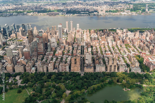 Aerial panoramic city view of Upper West Side Manhattan neighborhoods and the most visited urban park in the United States - Central Park, New York city. Helicopter cityscape from bird's eye view