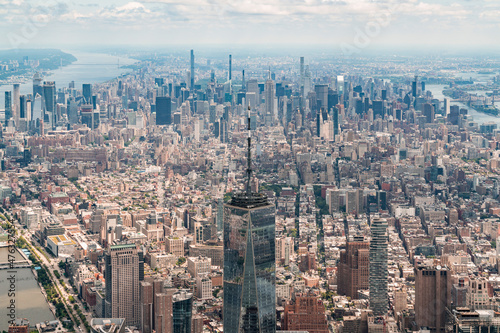 Aerial panoramic city view of Upper Manhattan district with the top of the World Trade Center, New York, USA. Bird's eye view from helicopter of metropolis cityscape. A vibrant business neighborhood