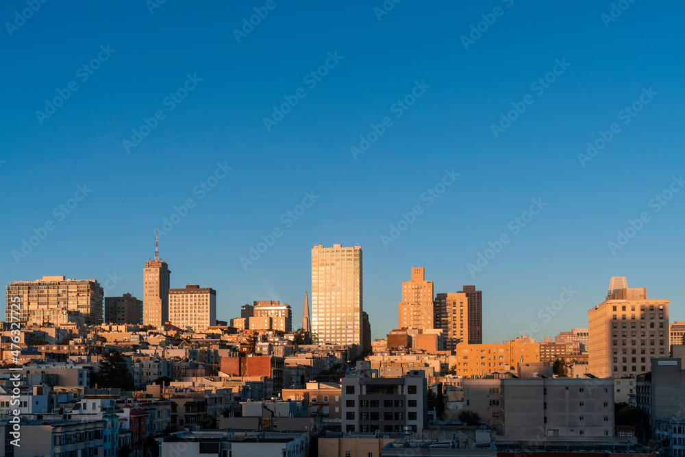 Panoramic cityscape view of San Francisco Nob hill area, which is historically known as a center of San Francisco upper class neighborhoods at golden hour, sunset, midtown, California, United States.