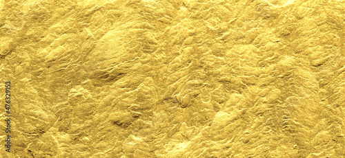 Gold grunge background. Gold stone background with copy space.