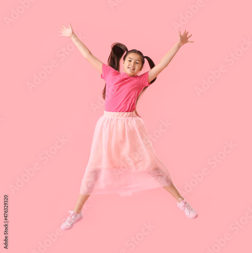 Jumping little girl on colo...