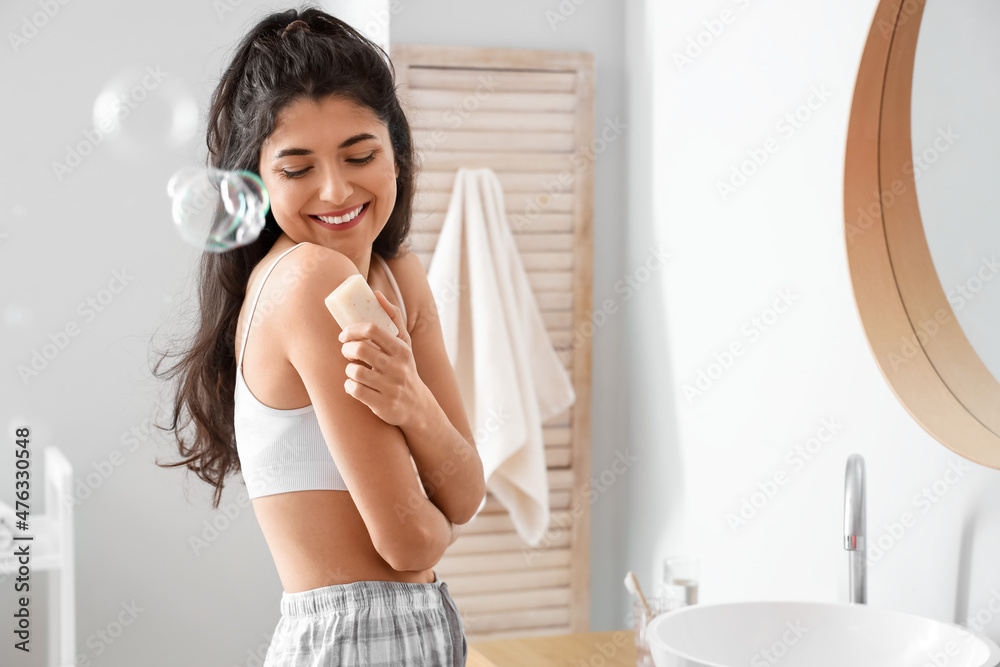 Morning of beautiful young woman with soap in bathroom Morning of beautiful young woman with soap in bathroom