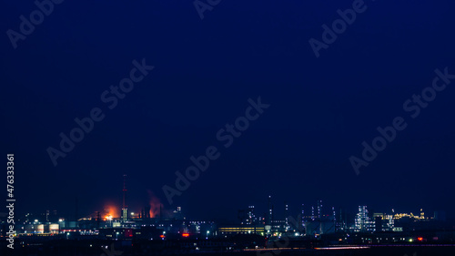 The brightly lit petrochemical plant.