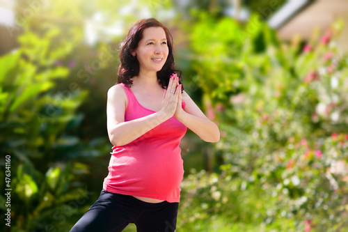 Pregnancy yoga. Exercise for pregnant woman.