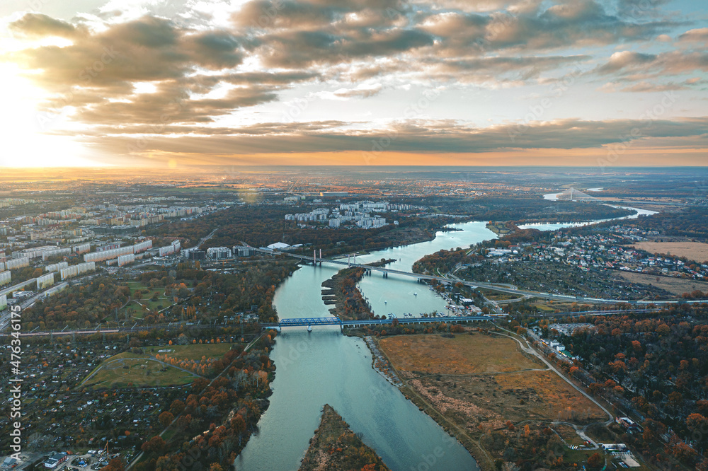 winding river flows against the sunset. View from above. Wroclaw, Poland