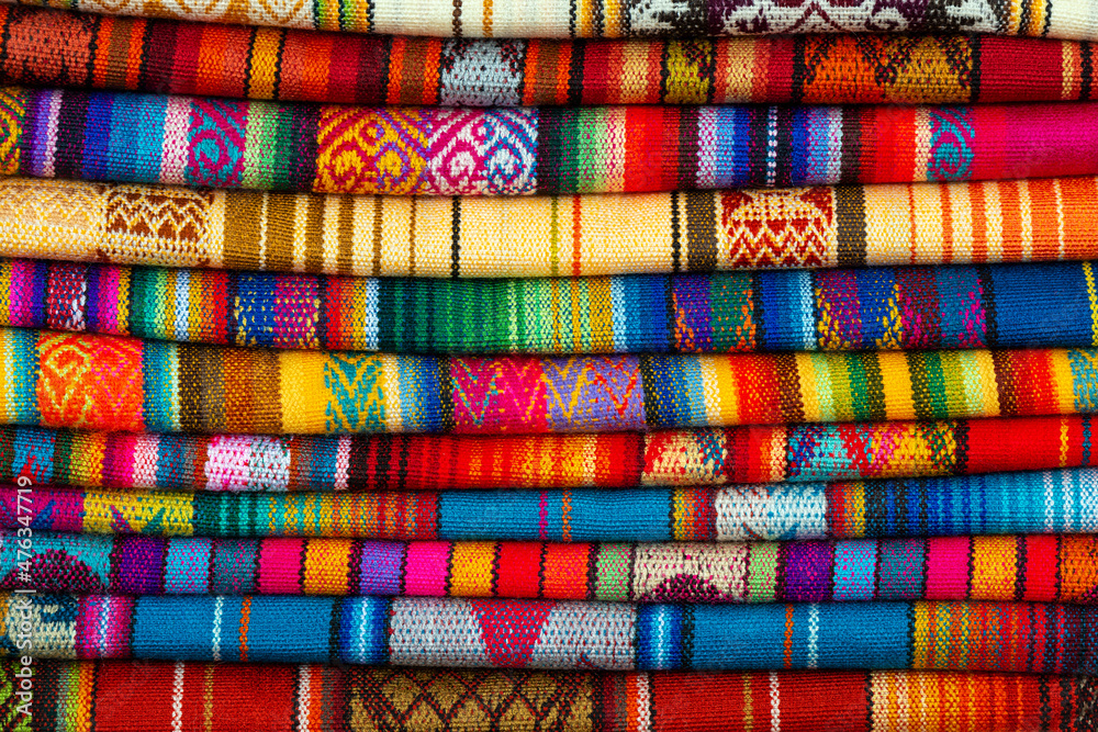 Pile of andean fabric on Otavalo handicraft market near Quito, Ecuador. Pile of andean fabric on Otavalo handicraft market near Quito, Ecuador.
