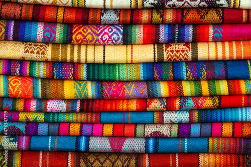 Pile of andean fabric on Otavalo handicraft market near Quito, Ecuador.