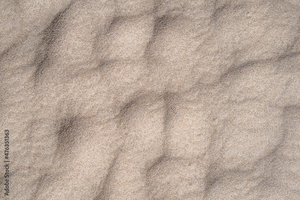 Obraz premium Sand Dune Dimple Background Pattern. Real Shot of Natural Sand for Subtle Textured Backdrop.