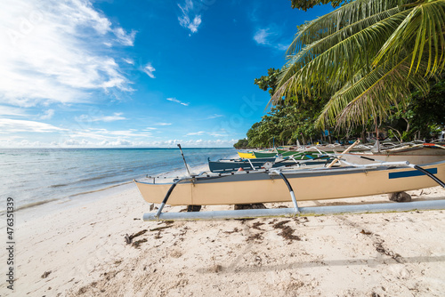 Small outrigger boats at Quinale Beach, Anda, Bohol photo