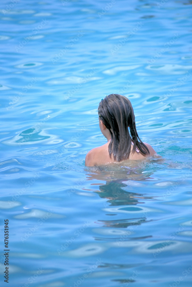 Woman in swimming pool.