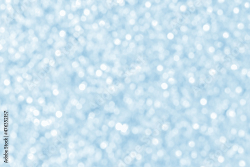 Abstract blue and white bokeh background. Christmas, New Year and all celebrations backgrounds concept. Snowfall in the winter background.