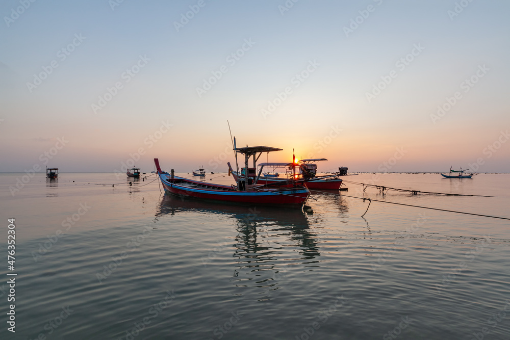 Landscape of fishing boats moored while the tide is lowers Landscape of fishing boats moored while the tide is lowers