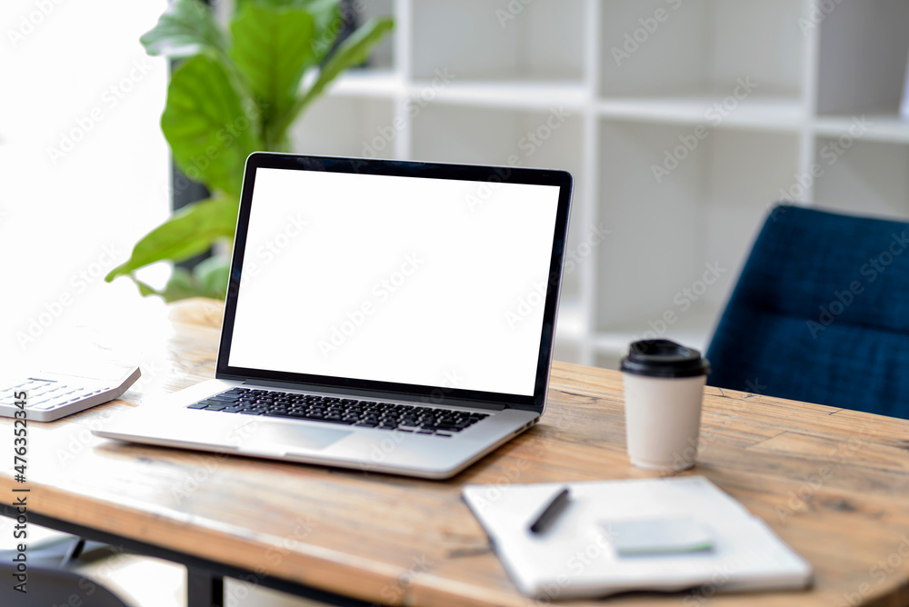 Laptop computer with blank white screen on table. Laptop computer with blank white screen on table.
