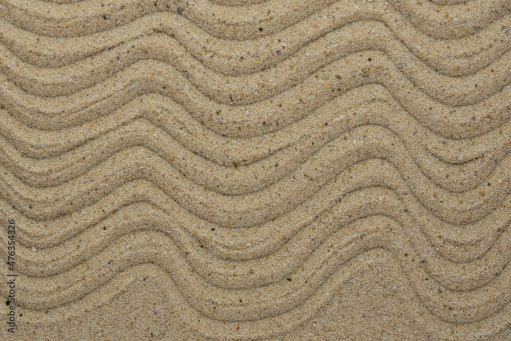 Zen sand garden meditation stone background with copy space. Stones and lines drawing in sand for relaxation. Concept of harmony, balance and meditation, spa, massage, relax Zen sand garden meditation stone background with copy space. Stones and lines drawing in sand for relaxation. Concept of harmony, balance and meditation, spa, massage, relax