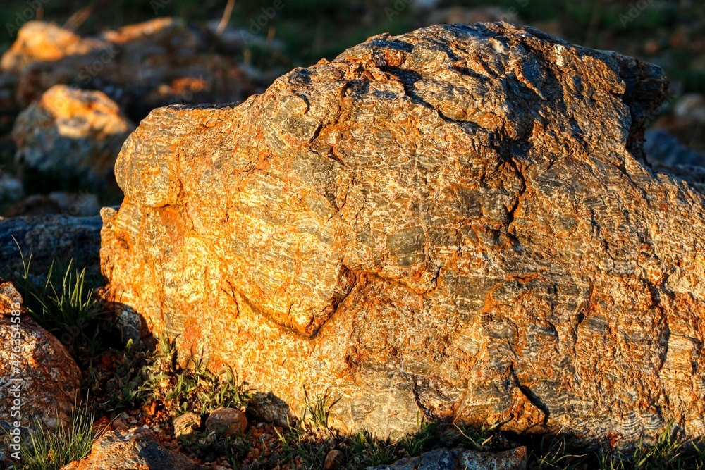 Beautiful rocks boulders in the savannah with the golden glow of sunset Beautiful rocks boulders in the savannah with the golden glow of sunset