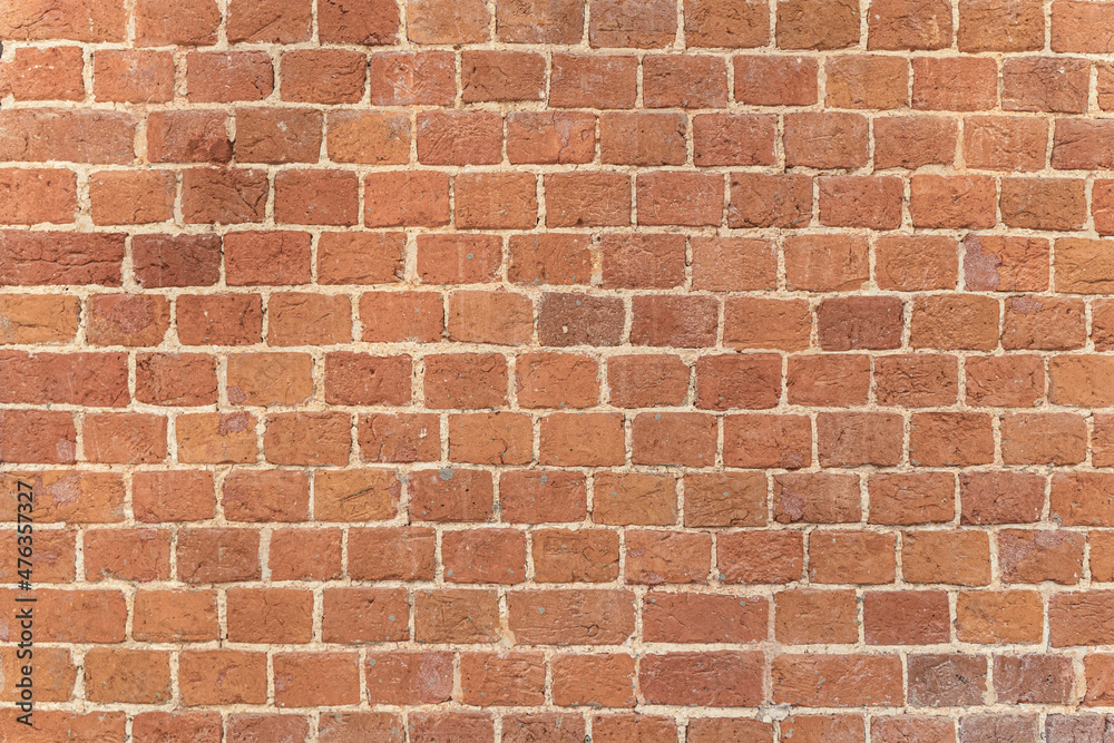 Old brick wall. Brickwork from an old brick in a rustic style. The structure and pattern of the destroyed stone wall. Copy space Old brick wall. Brickwork from an old brick in a rustic style. The structure and pattern of the destroyed stone wall. Copy space
