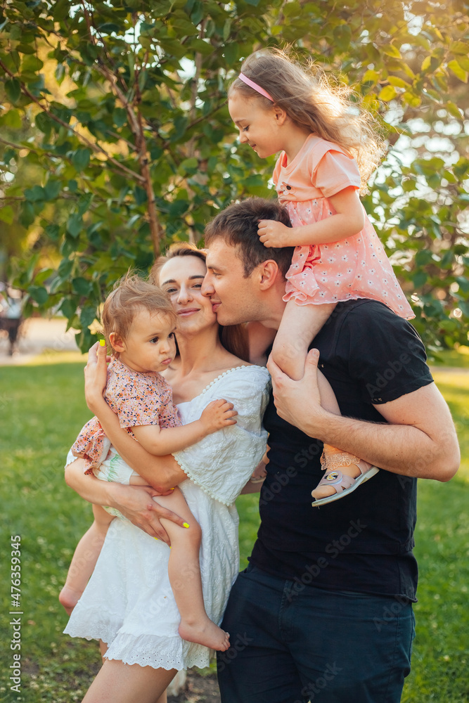 happy family on a walk in a summer park