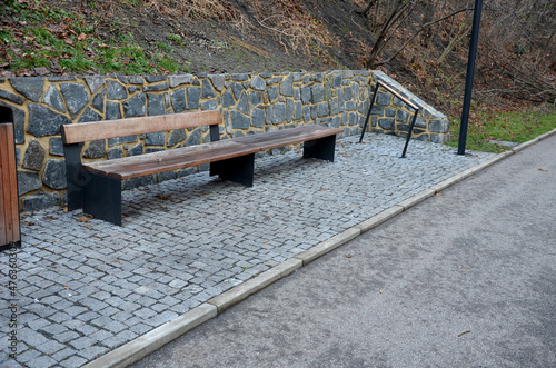 under the slope in the park are new garden rest areas. Cyclists have a public toilet, bathroom, bench and bike rack. the stands have a rhombus shape and everything is designed by a landscape architect