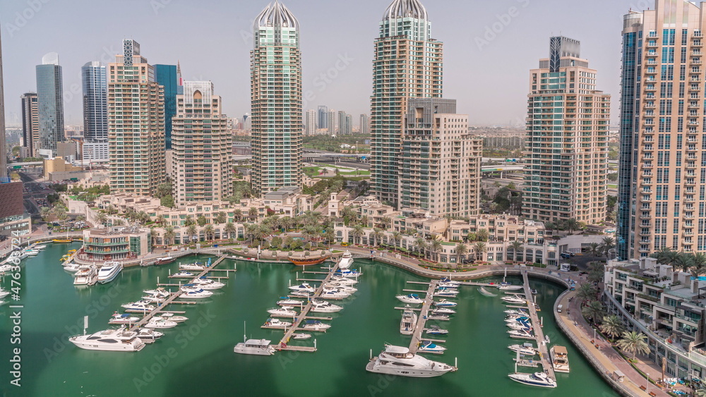 Luxury yacht bay in the city aerial timelapse in Dubai marina