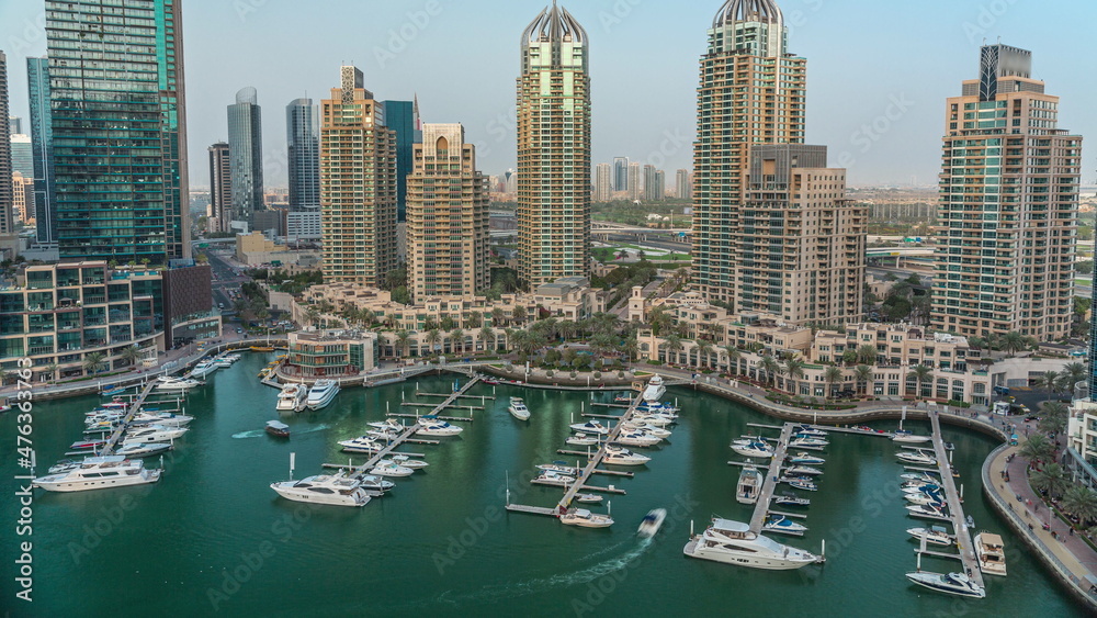 Obraz premium Luxury yacht bay in the city aerial timelapse in Dubai marina