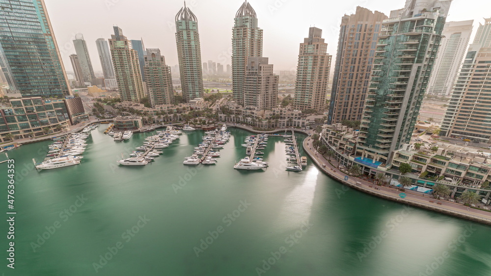 Luxury yacht bay in the city aerial timelapse in Dubai marina