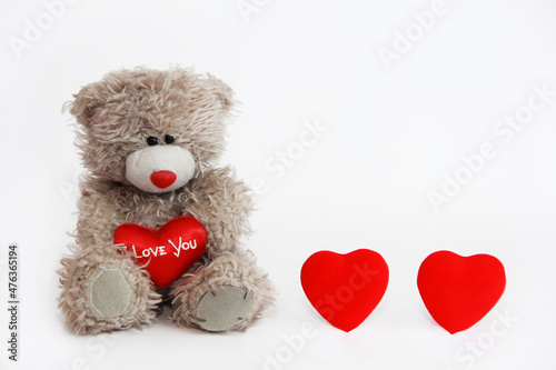 soft toy bear holding a red heart