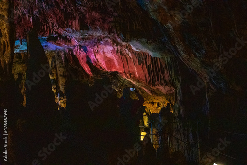 dark abstract background of stalactites, stalagmites and stalagnates in the Sfendoni cave, underground, horizontal