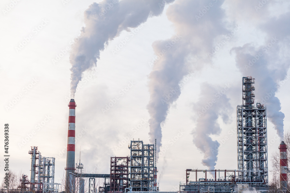 Petrochemical industrial factory of heavy industry, power refinery production with smoke pollution.Thick smoke is coming from the factory's chimney. smoke smog emissions bad ecology aerial photography