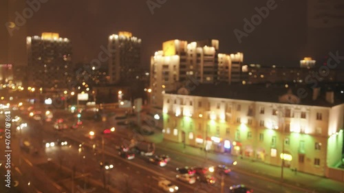 Wallpaper Mural Blurred view from the window to the lights of the evening city and the busy traffic along the avenue. Bokeh effect Torontodigital.ca