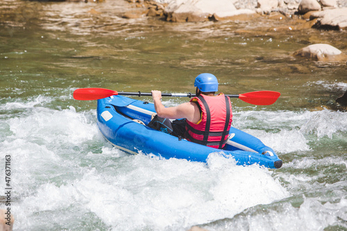 inflatable raft extreme sport at mountain river