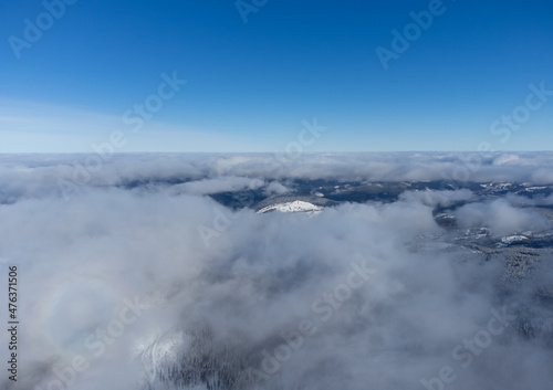 Landscape above the clouds with blue sky