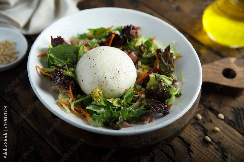 Healthy leaf salad with burrata cheese