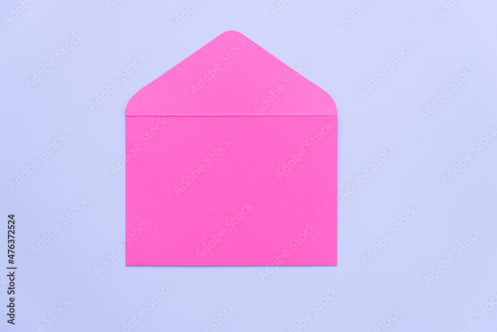 Bright pink envelope on a monochromatic background. Space for text. Valentine's Day. Congratulations on your wedding or birthday. Background, texture.