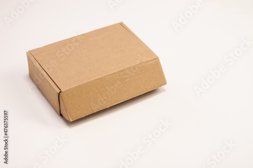 Small cardboard box for storing things on a white background. © Павел Шульмин