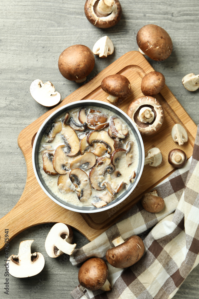 Concept of tasty food with mushroom sauce on gray wooden background Concept of tasty food with mushroom sauce on gray wooden background