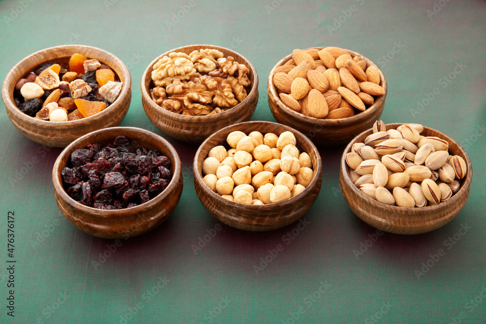 nuts and dried fruits in bamboo plates nuts and dried fruits in bamboo plates