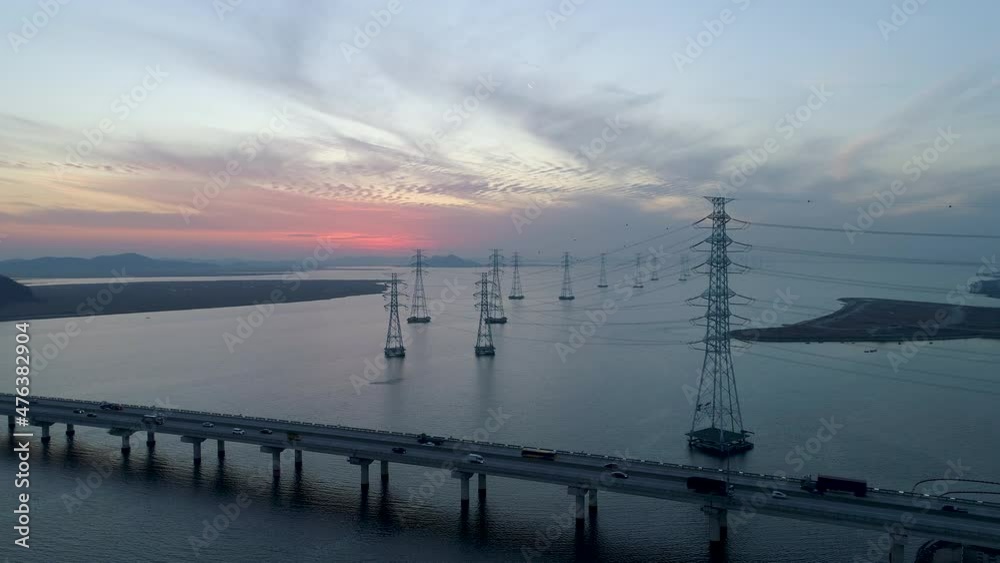 Aerial view of electric transmission tower above the sea, high voltage steel pylon, power, electric, energy, industry. 시화호, 철탑, 고압선, 송전탑, 저녁, 노을. Aerial view of electric transmission tower above the sea, high voltage steel pylon, power, electric, energy, industry. 시화호, 철탑, 고압선, 송전탑, 저녁, 노을.