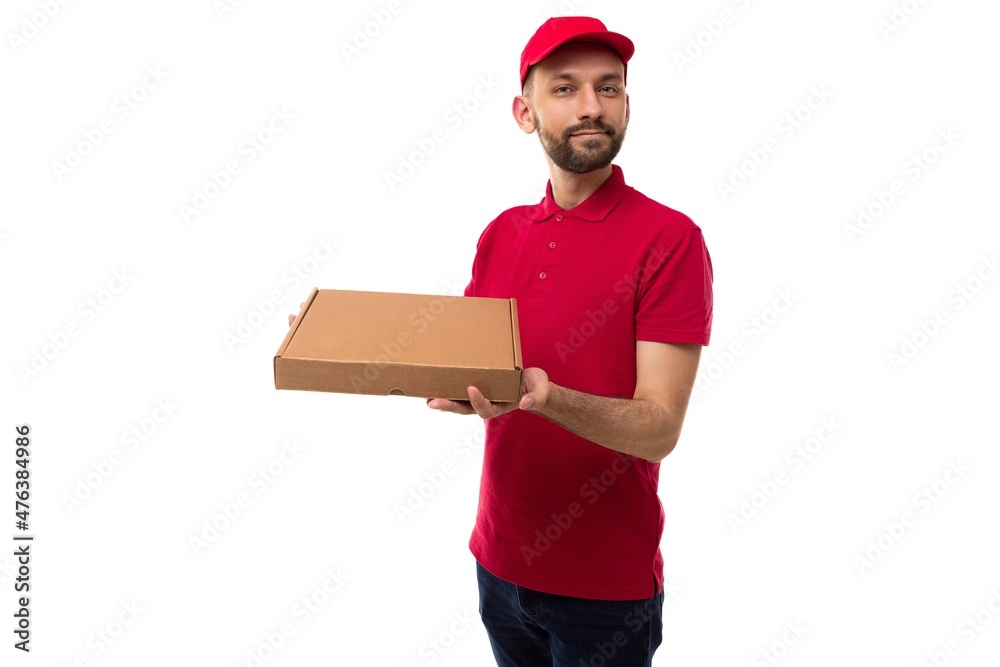 delivery courier in red uniform holding a box of pizza delivery courier in red uniform holding a box of pizza