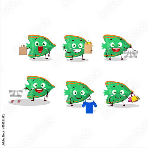 A Rich fish green gummy candy mascot design style going shopping