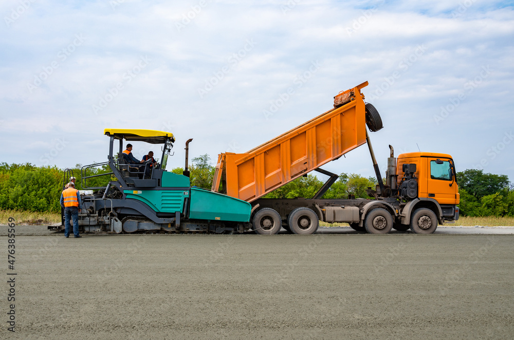 Obraz premium Road construction, asphalt concrete paving