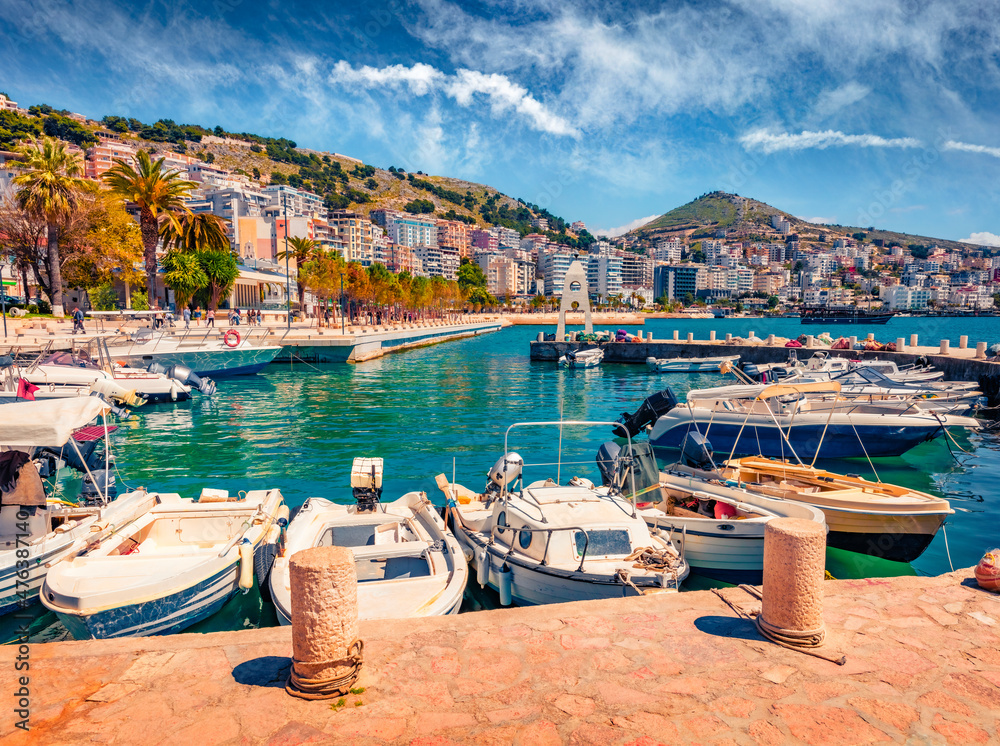 Obraz premium Wonderful spring cityscape of Saranda port. Beautiful Ioninian seascape. Colorful morning scene of Albania, Europe. Traveling concept background.