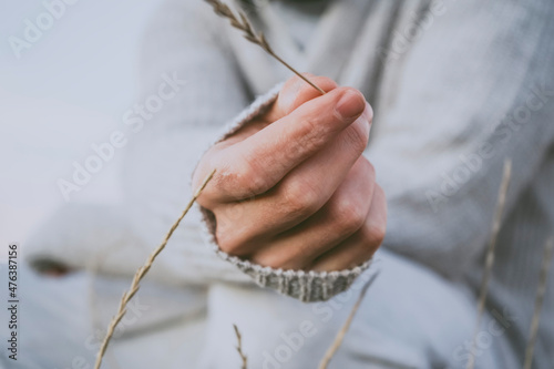 Delicate image of a young man touching nature