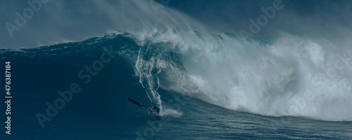 Sport photography. Jaws swell on International surfing event in Maui, Hawai 2021 December.