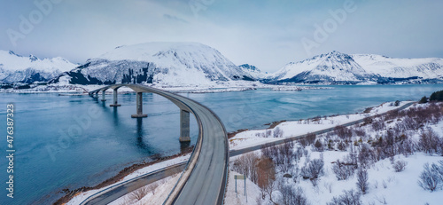 Dramatic view from flying drone of Gimsoystraumen bridge. Cold winter scene of Lofoten Islands, Norway, Europe. Gloomy evening seascape of Norwegian sea. Life over polar circle. © Andrew Mayovskyy