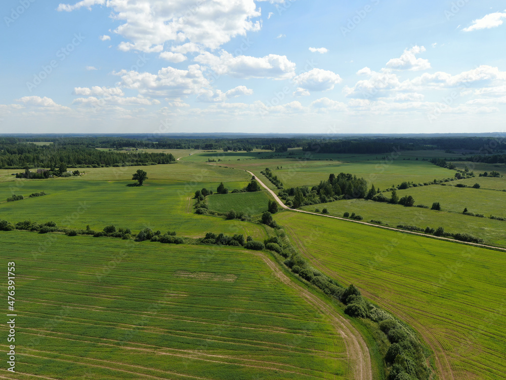 Aerial view of a landscape with vast green fields