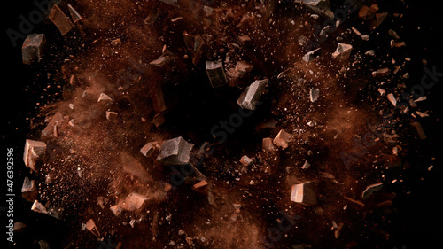 Foto Freeze motion of flying group of raw chocolate pieces.