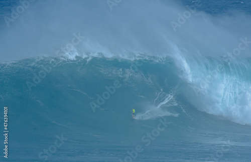 Sport photography. Jaws swell on International surfing event in Maui  Hawai 2021 December.