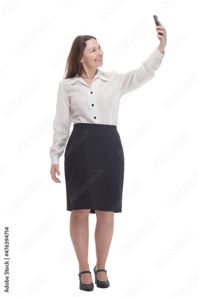 in full growth. smiling business woman with a smartphone . in full growth. smiling business woman with a smartphone .