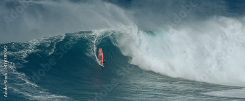 Sport photography. Jaws swell on International surfing event in Maui, Hawai 2021 December.