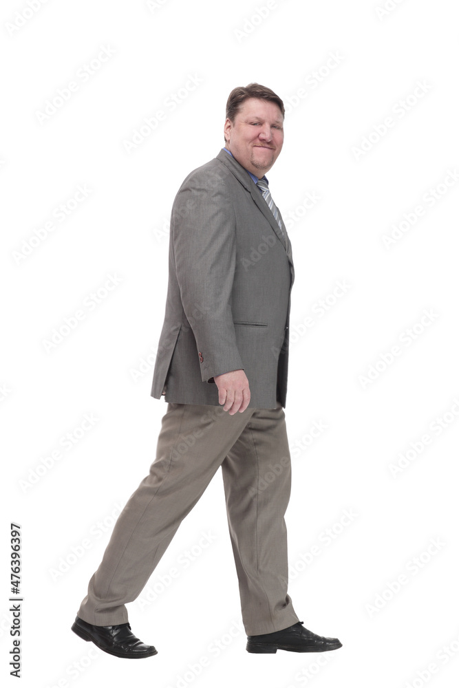 full-length. casual man in a grey jacket striding forward. full-length. casual man in a grey jacket striding forward.
